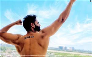 Parmish Verma with a back tattoo of Param-Sat (eternal truth)